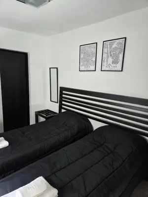 two beds sitting next to each other in a bedroom at PINZON 1984 in Cordoba