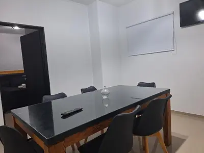 a meeting room with a table and chairs at PINZON 1984 in Cordoba