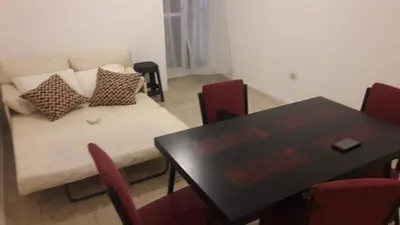 a living room with a table and a couch at DPTO ALTA CORDOBA in Cordoba