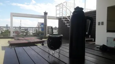 a black fire hydrant sitting on top of a deck at DPTO ALTA CORDOBA in Cordoba