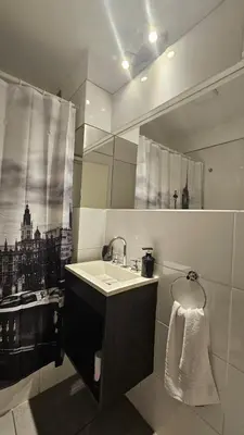 a bathroom with a sink and a mirror at LitStay Laprida in Cordoba
