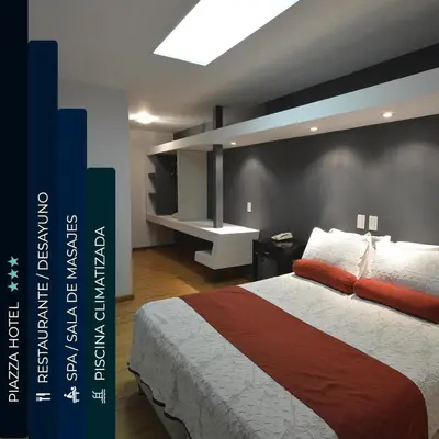 a bedroom with a bed and a black wall at Piazza Hotel in Villa Carlos Paz
