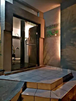 a dressing room with a mirror and a bench at Noria Hotel in Villa Carlos Paz