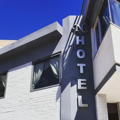 a sign on the side of a building at Noria Hotel in Villa Carlos Paz