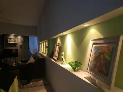a living room with a painting on the wall at Noria Hotel in Villa Carlos Paz