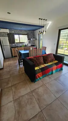 a living room with a couch and a table at La Guarida del Zorro in Merlo