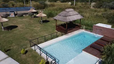 an overhead view of a swimming pool with a gazebo at La Guarida del Zorro in Merlo