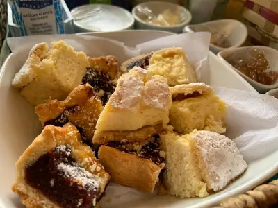 a white plate of desserts on a table at Casas de Campo Henin in Villa General Belgrano