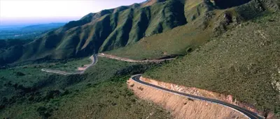 a winding road on the side of a mountain at El Rincón del Molle in Merlo