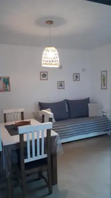 a living room with a couch and a table at Ensueño in Santa Rosa de Calamuchita