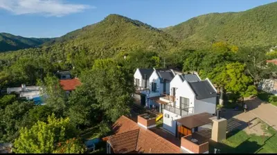 an aerial view of a house with mountains in the background at Ensueño in Santa Rosa de Calamuchita