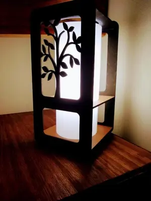 a mirror with a light on top of a wooden floor at CAMINITOS in Villa General Belgrano