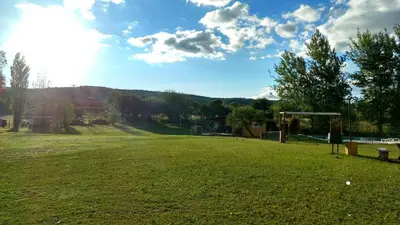 a large grassy field with a soccer goal at Casa de campo La Querencia in Villa Cura Brochero