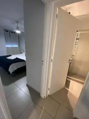 a room with a door leading to a bedroom at LitStay Brasil con cochera, pileta y asadores in Cordoba