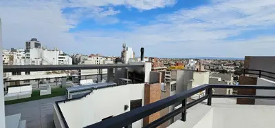 a view of a city from the balcony of a building at LitStay Brasil con cochera, pileta y asadores in Cordoba
