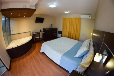 a bedroom with a bed and a tub in it at La Frida Hotel - ADULTS ONLY in Nono