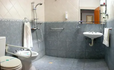 a bathroom with a toilet and a sink at Complejo Sol in Villa Carlos Paz