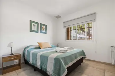 a bedroom with a bed and a window at El Puerto - Cerca de todo in Cordoba