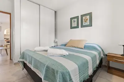 a bedroom with a bed with two pillows on it at El Puerto - Cerca de todo in Cordoba