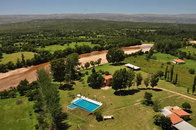 an aerial view of a house and a river at Casa grande La Querencia in Villa Cura Brochero