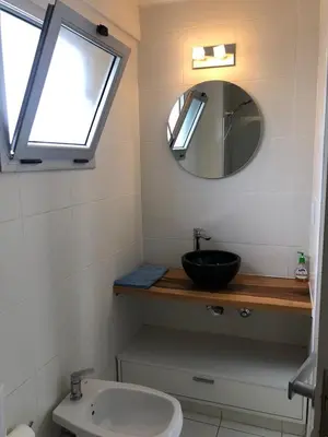 a bathroom with a sink and a mirror at FOREST 7º in Cordoba