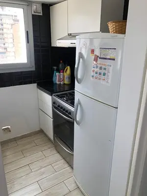 a kitchen with a white refrigerator and a stove at FOREST 7º in Cordoba