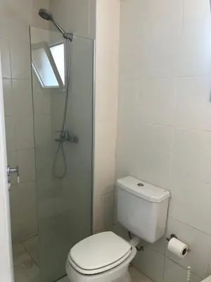a bathroom with a toilet and a shower with a window at FOREST 7º in Cordoba