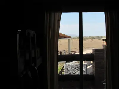 a window with a view of a field outside at Terrazas De Potrero in Potrero de Garay