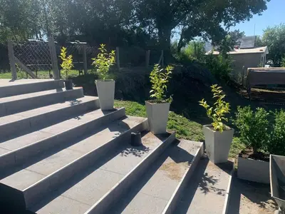 a group of concrete steps with plants in them at COMPLEJO AYRES DE MAYU SUMAJ in Villa Carlos Paz