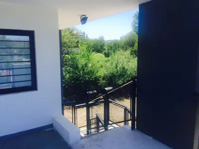 a view of a balcony from a house at COMPLEJO AYRES DE MAYU SUMAJ in Villa Carlos Paz