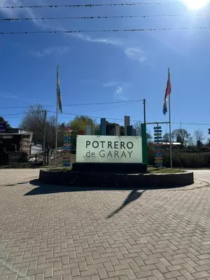 a sign for a poter de gaany in a parking lot at HERMOSA CASA 2 DORMITORIOS EN POTRERO DE GARAY in Potrero de Garay
