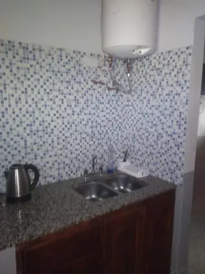 a kitchen with a sink and a counter top at Susurro de Montaña (TIERRA SANTA) in San Lorenzo