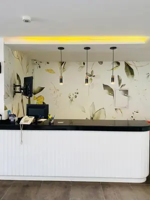 a white counter with butterflies on the wall at Ranqueles in Villa Carlos Paz