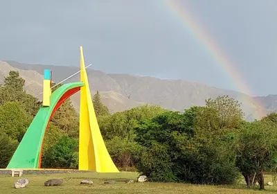 a rainbow over a park with a rainbow at Nuevo Hotel Aguada del Zorro in Merlo