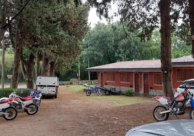 a group of motorcycles parked in front of a house at Nuevo Hotel Aguada del Zorro in Merlo