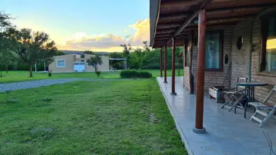 a porch of a house with a table and chairs at Casa Abierta in Nono