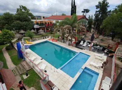 an overhead view of a large swimming pool at Gran Turín Hotel Boutique parque,arte y tecnología in Villa Carlos Paz