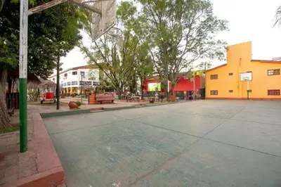 an empty basketball court with a basketball hoop at Gran Turín Hotel Boutique parque,arte y tecnología in Villa Carlos Paz