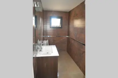 a bathroom with a sink and a bath tub at Dto con pileta en Carlos Paz 33! in Villa Carlos Paz
