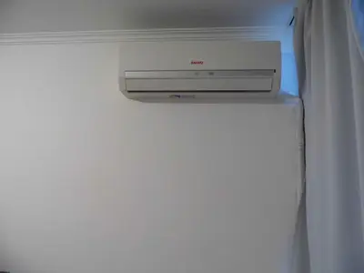 a computer monitor sitting on top of a refrigerator at Ayres de Las Sierras in Villa Carlos Paz