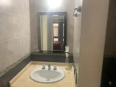 a bathroom with a sink and a mirror at Ayres de Las Sierras in Villa Carlos Paz