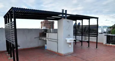 a metal structure on the roof of a building at Serena in Villa Carlos Paz