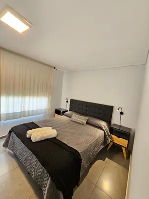 a bedroom with two beds and a window at LitStay Laprida 2 in Cordoba