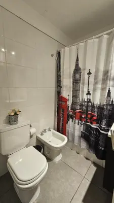 a bathroom with a toilet and a picture of big ben at LitStay Laprida 2 in Cordoba