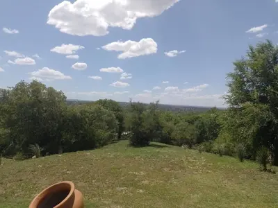 a view from the top of a hill with trees at Cabaña Las liebres in San Roque