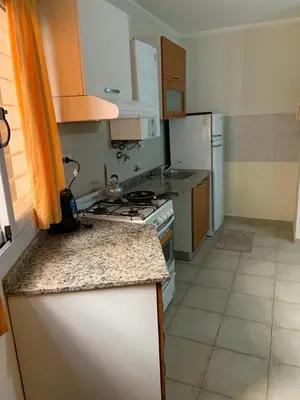 a kitchen with a stove and a counter top at DEPARTAMENTO CARLOS PAZ in Villa Carlos Paz