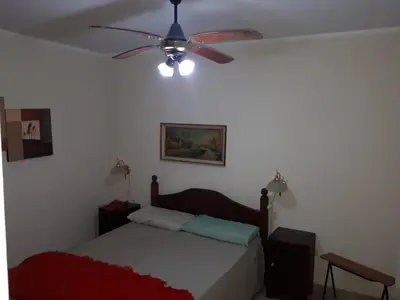 a bedroom with a bed with a ceiling fan at DEPARTAMENTO CARLOS PAZ in Villa Carlos Paz