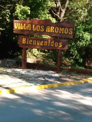 a sign for the university of botswana and bernarios at Villa Coca -Los Jilgueros- in La Bolsa