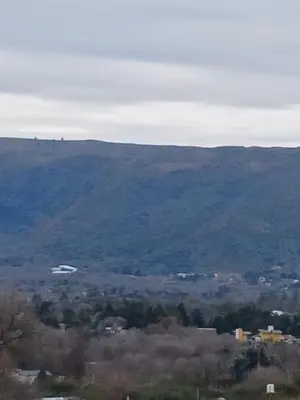 a view of a valley with mountains in the distance at Complejo SARA HOUSE in Santa Rosa de Calamuchita
