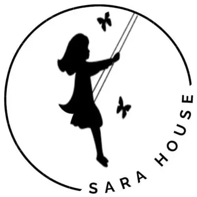 a girl on a swing with butterflies in a circle at Complejo SARA HOUSE in Santa Rosa de Calamuchita